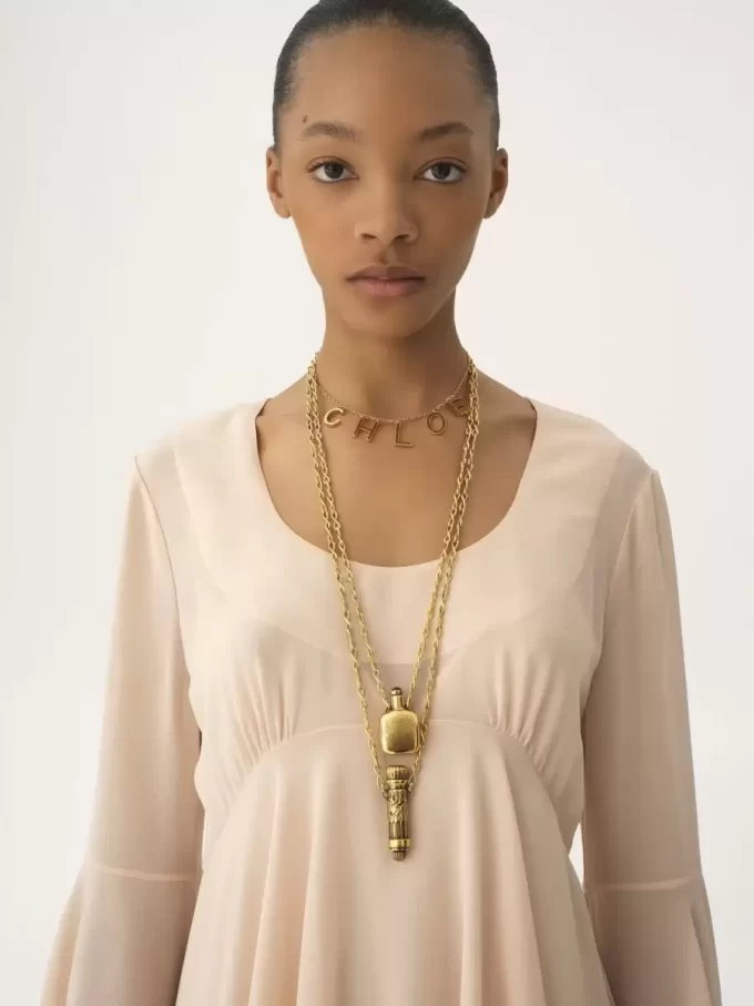 Flared mini dress in silk georgette