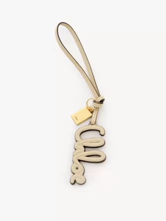 Logo bag charm in shiny leather