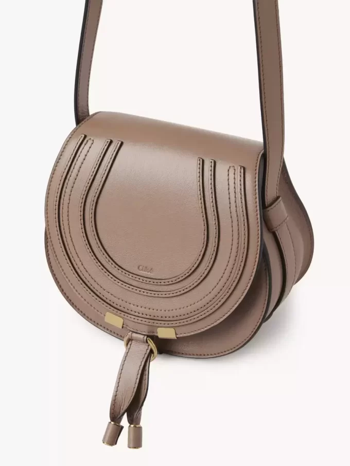 Small Marcie saddle bag in shiny leather