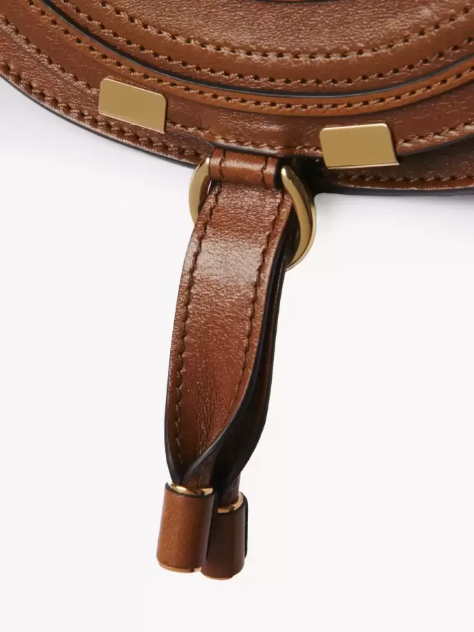Small Marcie saddle bag in shiny leather