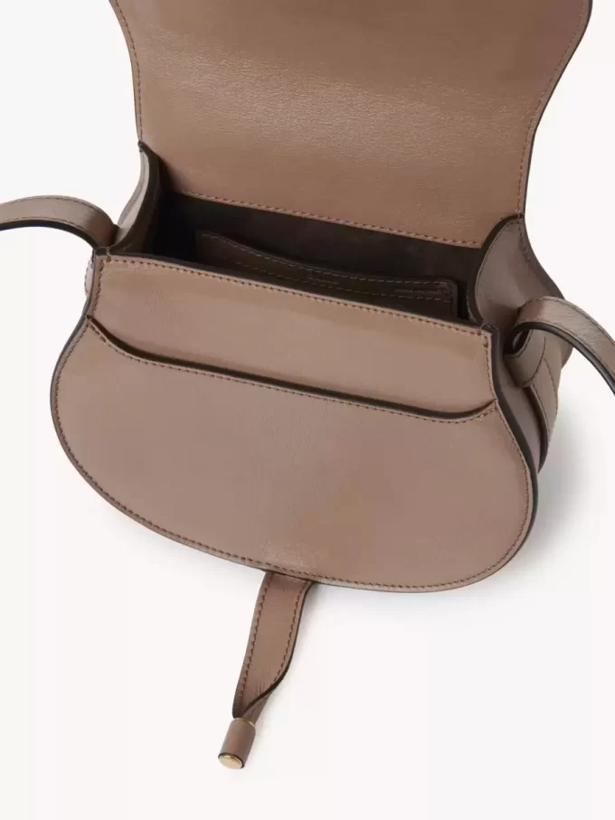 Small Marcie saddle bag in shiny leather