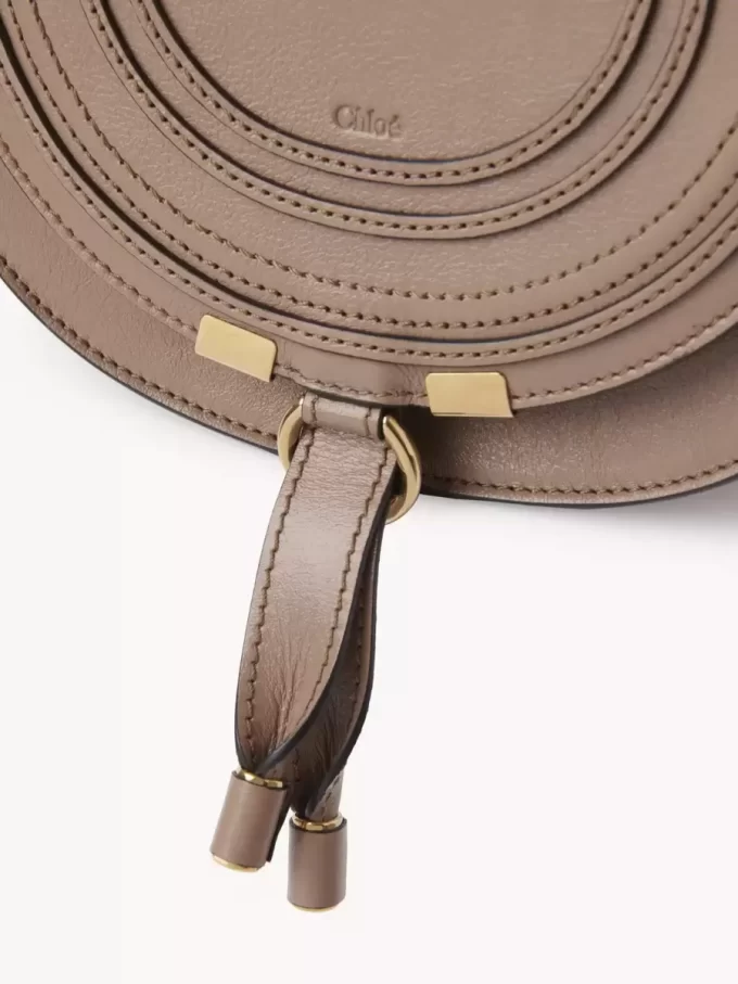 Small Marcie saddle bag in shiny leather