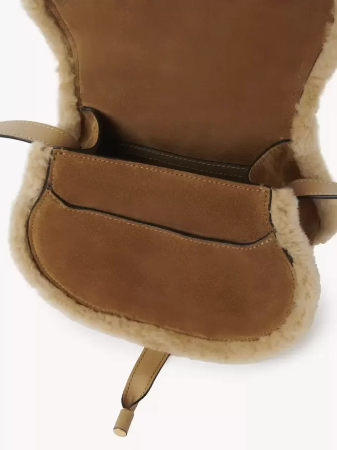 Small Marcie saddle bag in suede leather & shearling
