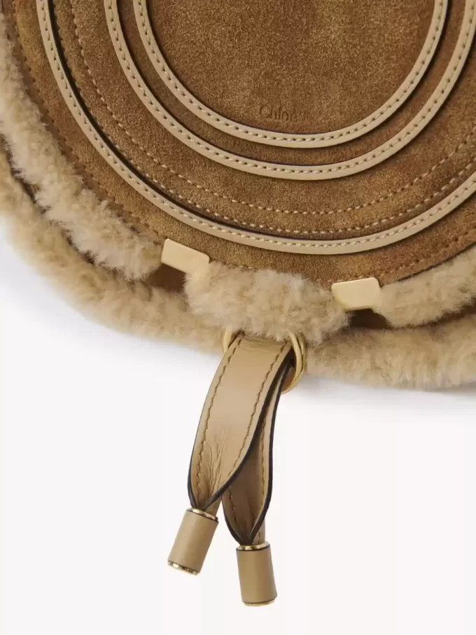 Small Marcie saddle bag in suede leather & shearling