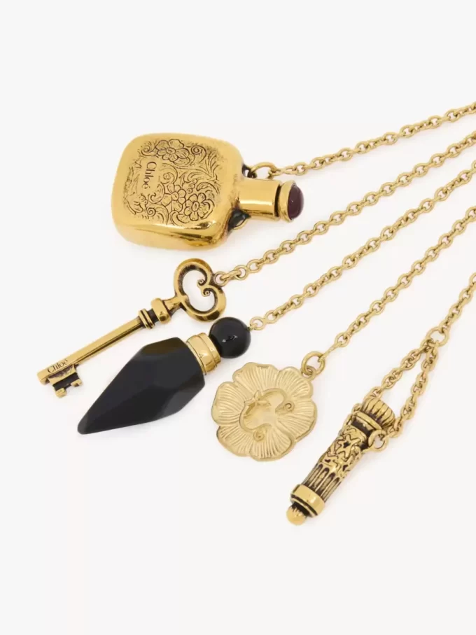 The Château Treasures charm in brass & resin