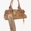 The Treasure Tails charm in shearling