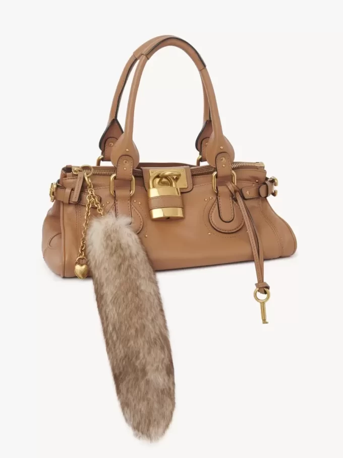 The Treasure Tails charm in shearling
